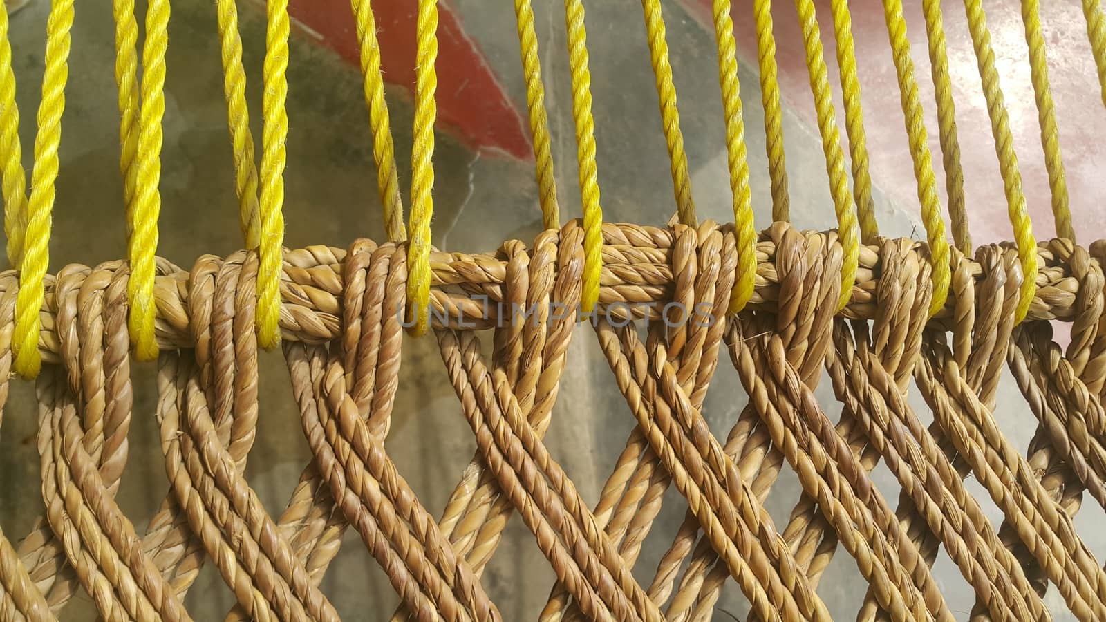 Closeup view of dried jute thread or ropes interwoven for making traditional old style bed called charpai