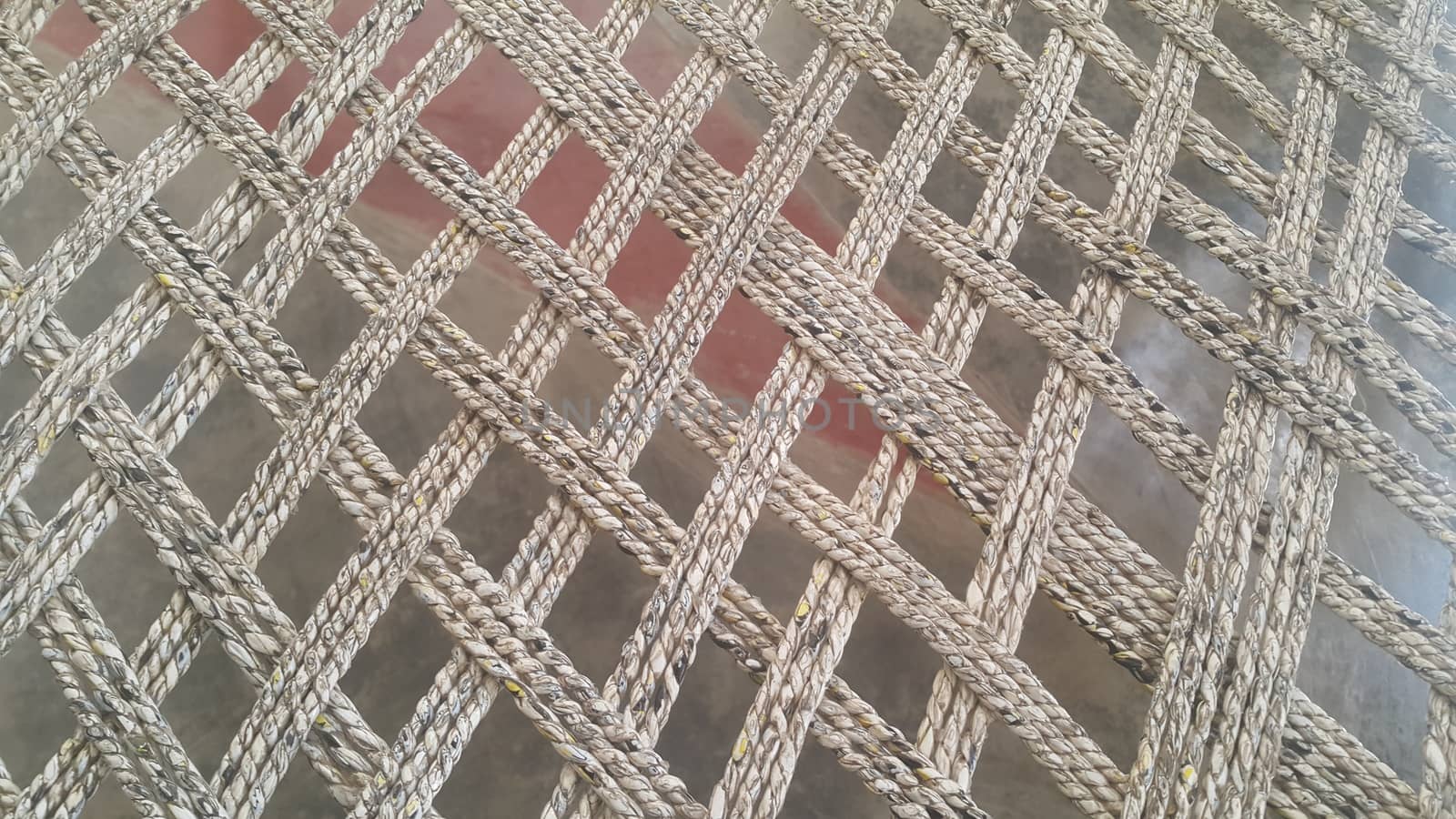 Closeup view of dried jute thread or ropes interwoven for making traditional old style bed called charpai