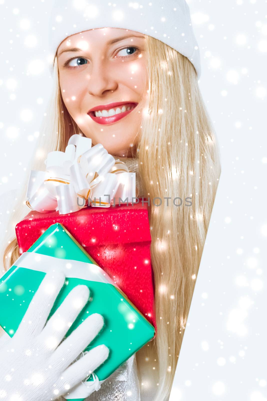 Magical Christmas and glitter snow background, happy blonde with gift boxes in winter season for shopping sale and holiday brands