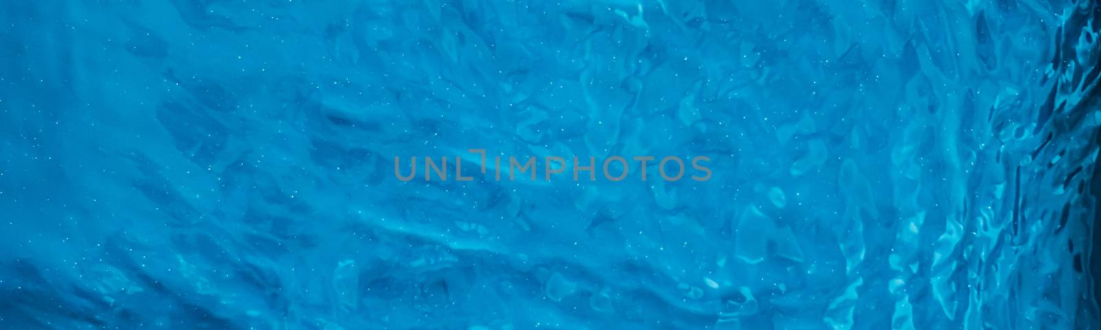 Blue water texture as abstract background, swimming pool and waves design by Anneleven