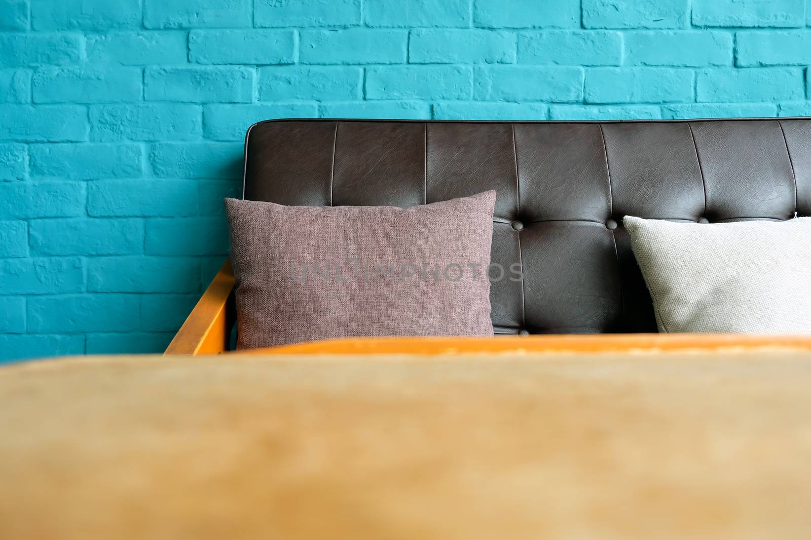 Detail of Living room with Leather sofa on blue brick wall Background
