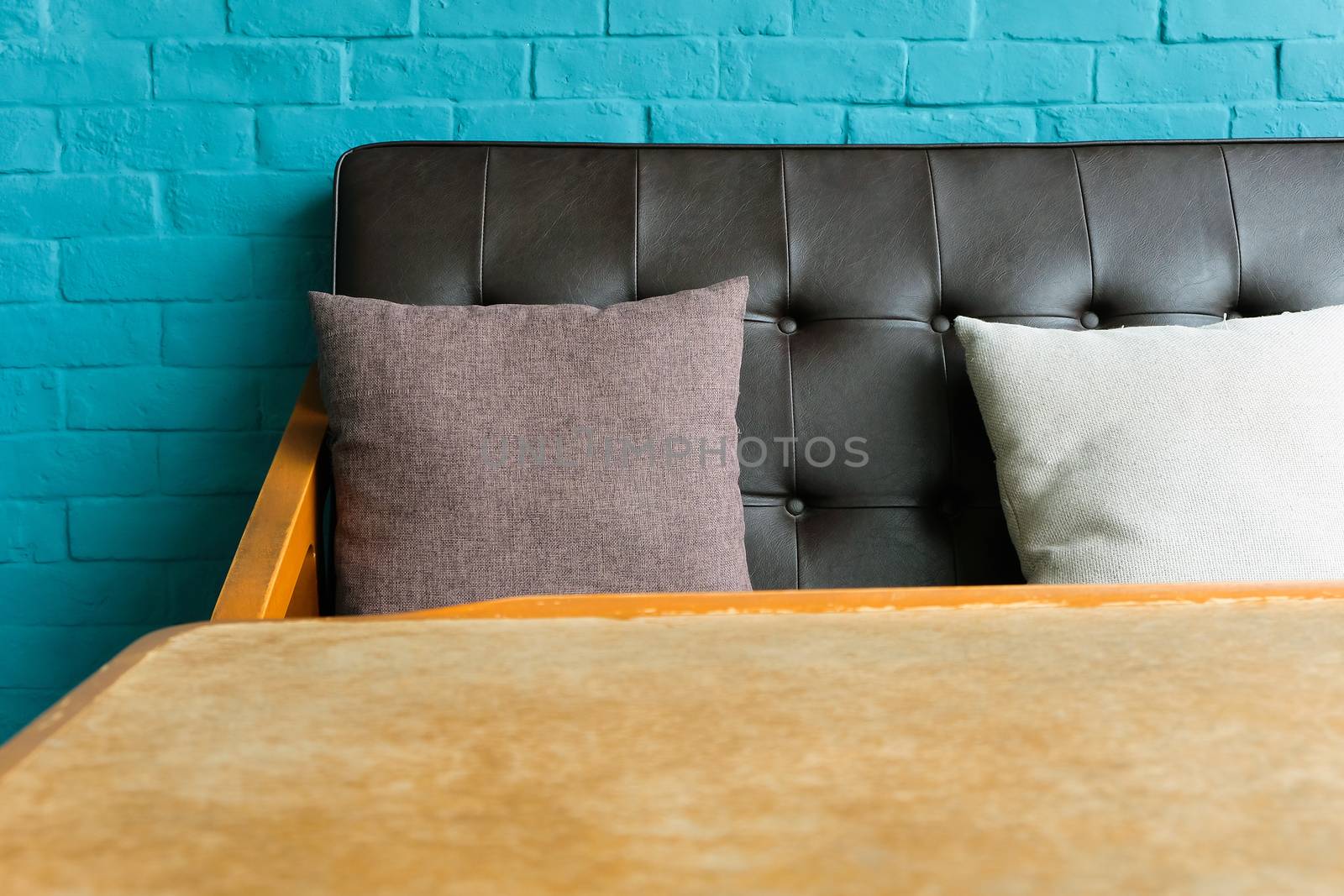 Detail of Living room with Leather sofa on blue brick wall Background