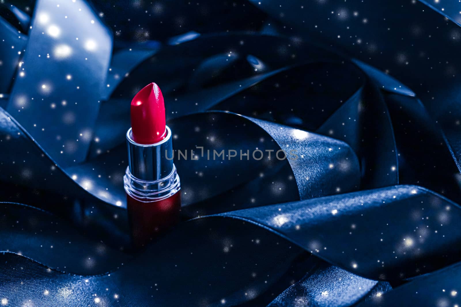 Red lipstick on blue silk and shiny glitter background, luxury make-up and beauty cosmetic by Anneleven