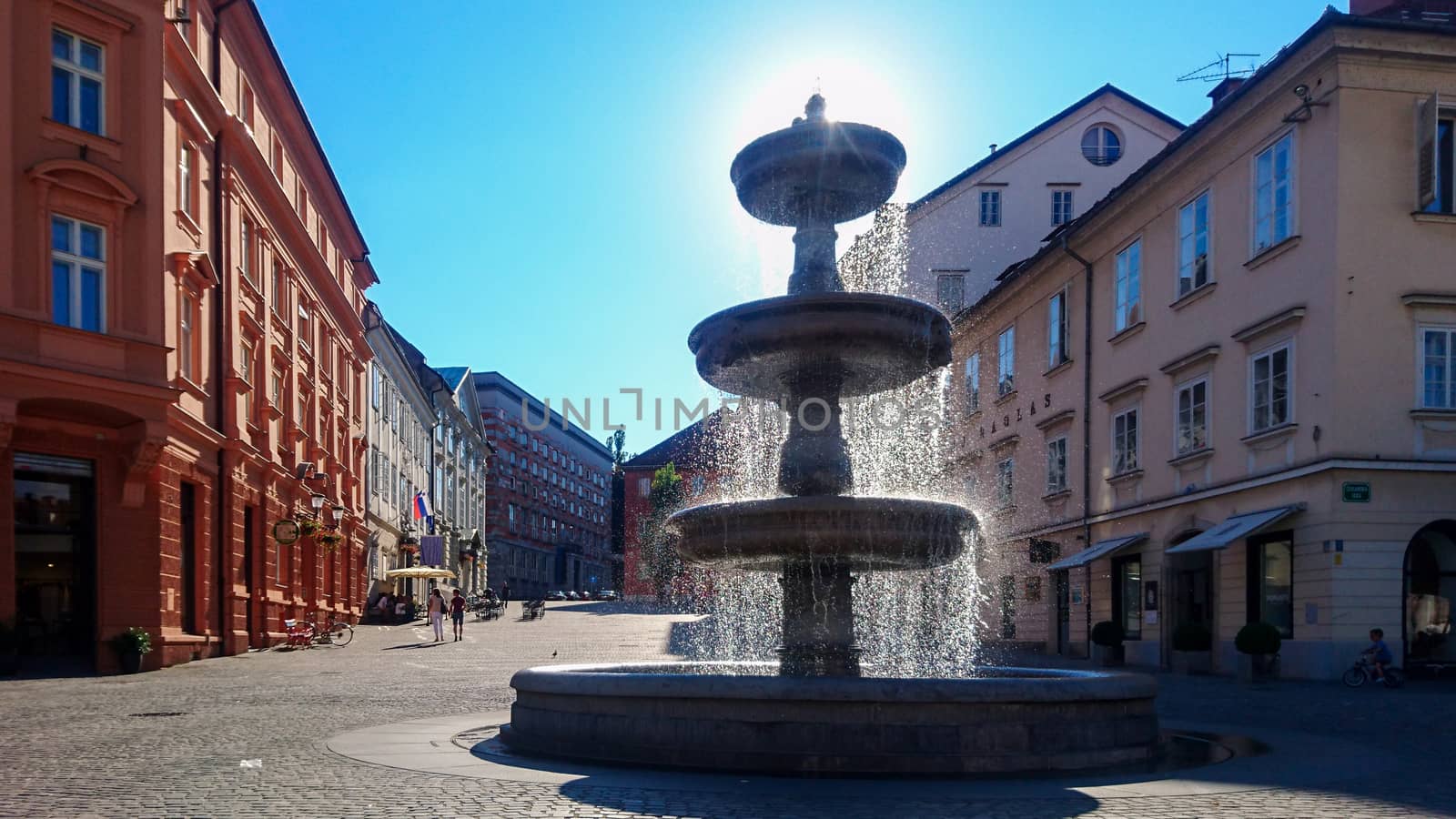 Ljubljana, Slovenia, July 2017: View on Vodnjak na Novem trgu fountain in Ljubljana, Slovenia, looking into Novi trg street