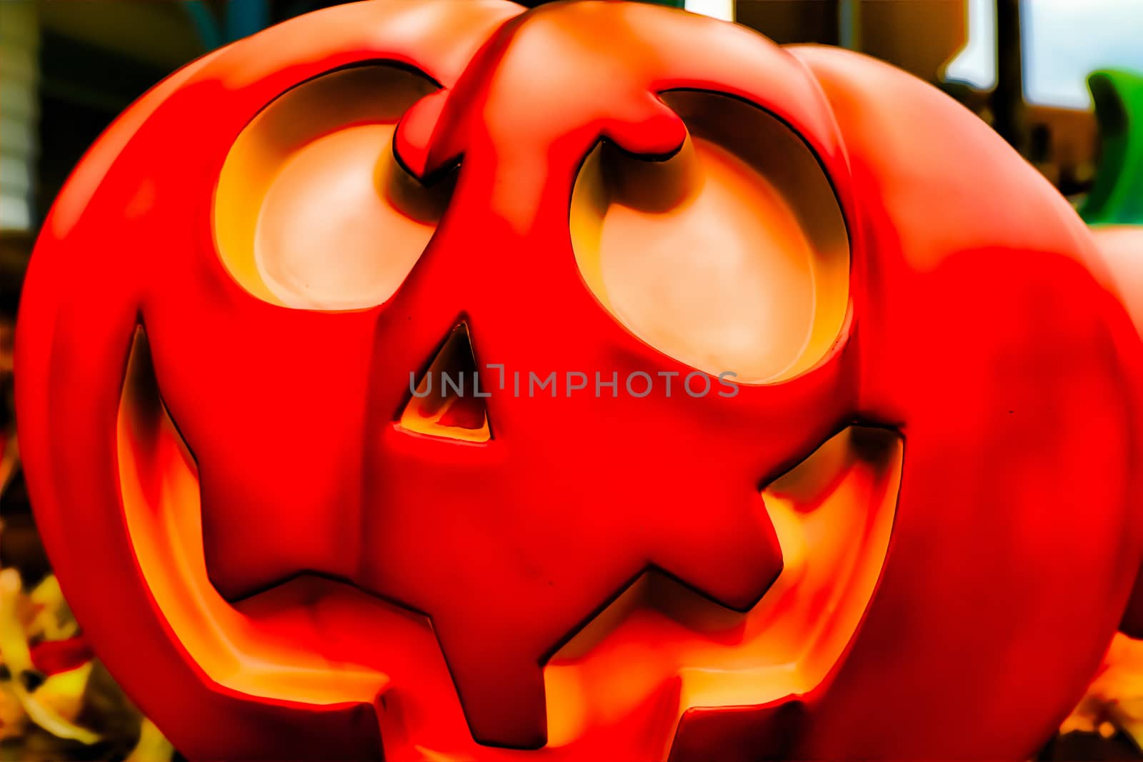 Halloween decorations concept.Close up of Jack O'lantern, vintage lanterns, pumpkins, skull, autumn leaves. Colorful Halloween. Happy Halloween scene background