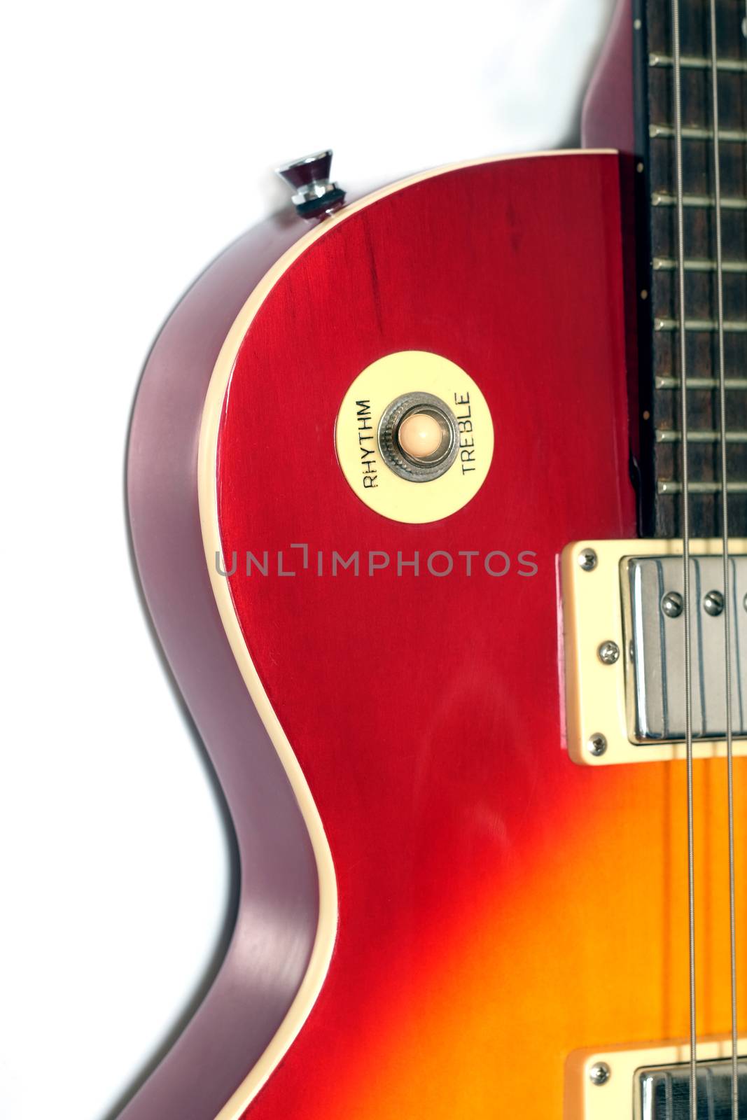 Part of vintage electric guitar wineburst color isolated on white vertical view by dymaxfoto