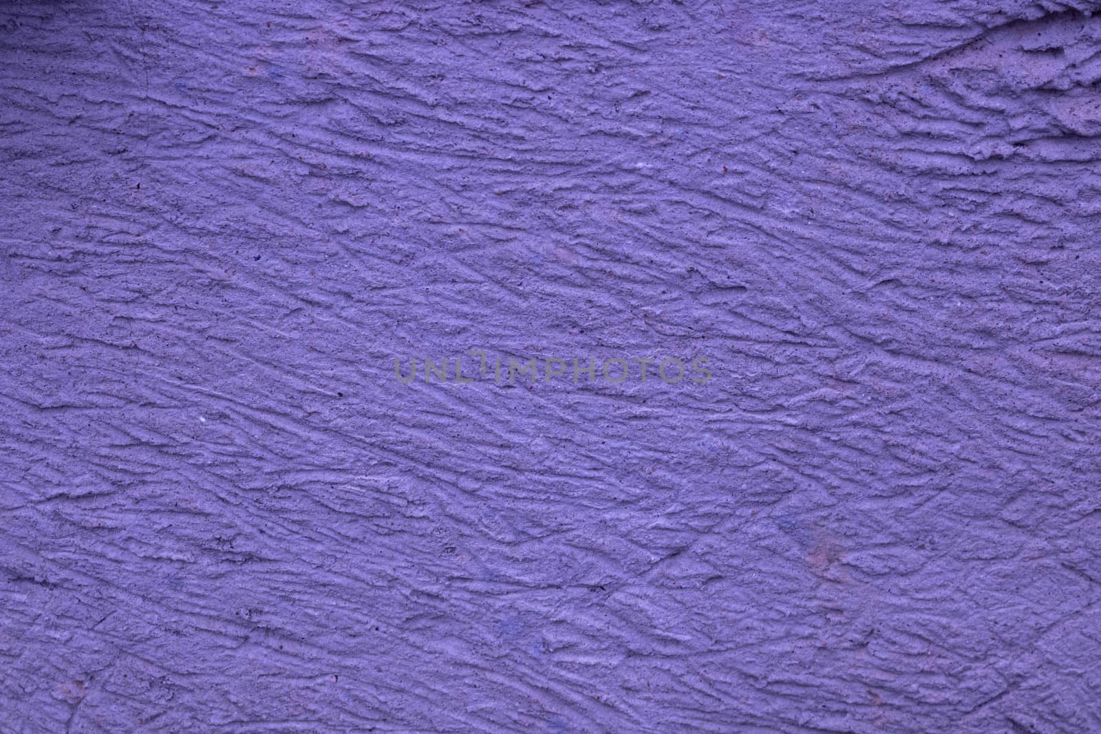 Lilac background with decorative relief . Lilac wall background.