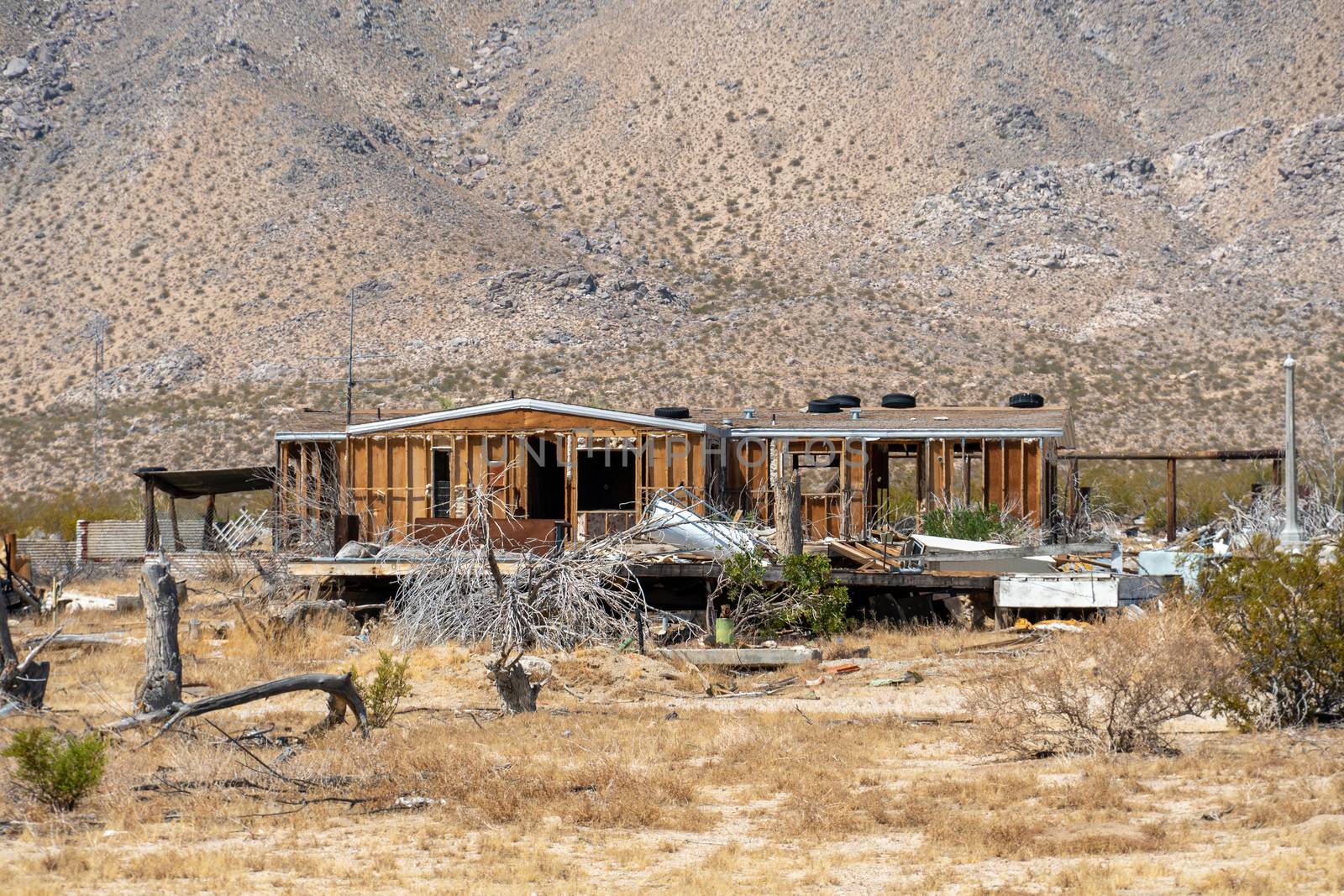 Abandoned house camper trailer in the middle of the desert in California's Mojave desert, near Ridgecrest. 