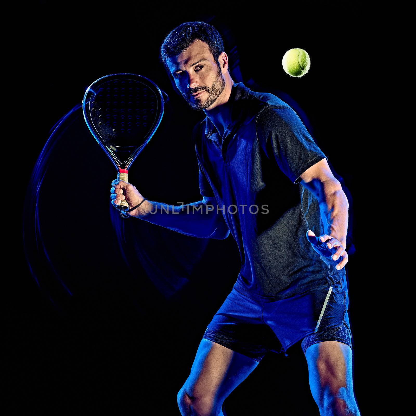 Paddle tennis player man light painting isolated black background by PIXSTILL
