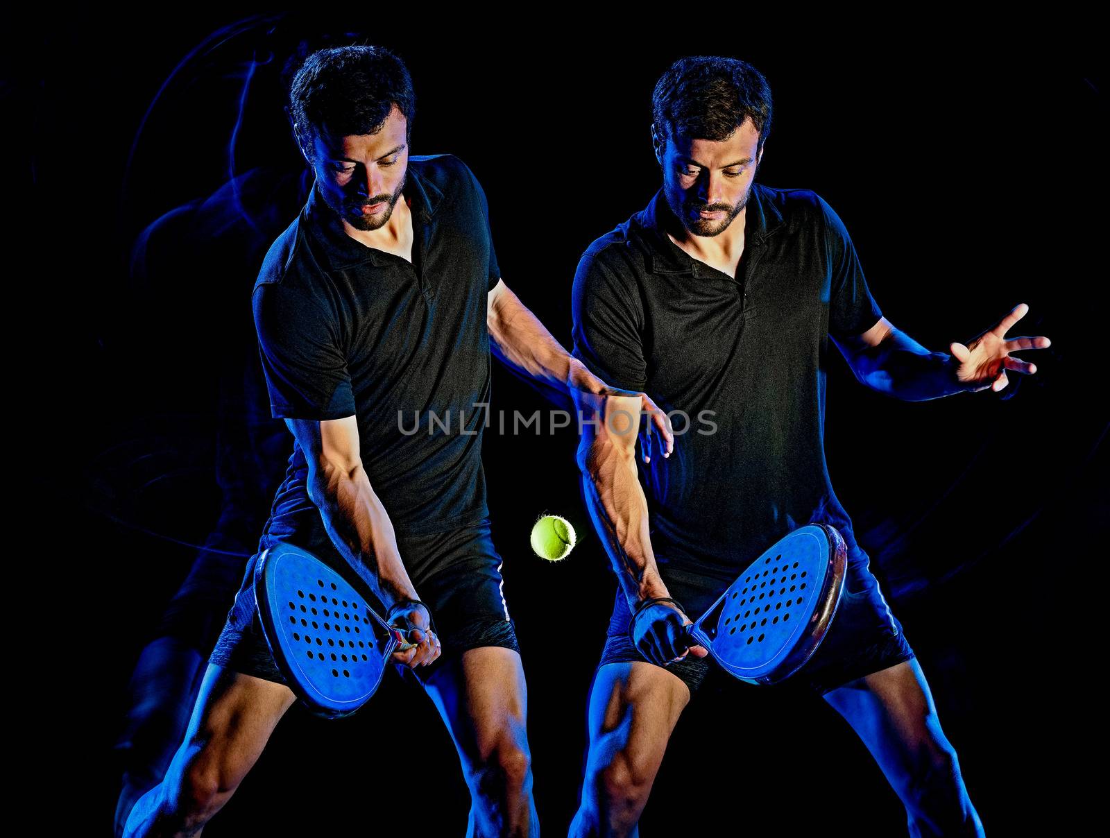 one caucasian Paddle tennis player man studio shot isolated on black background with multiple exposure