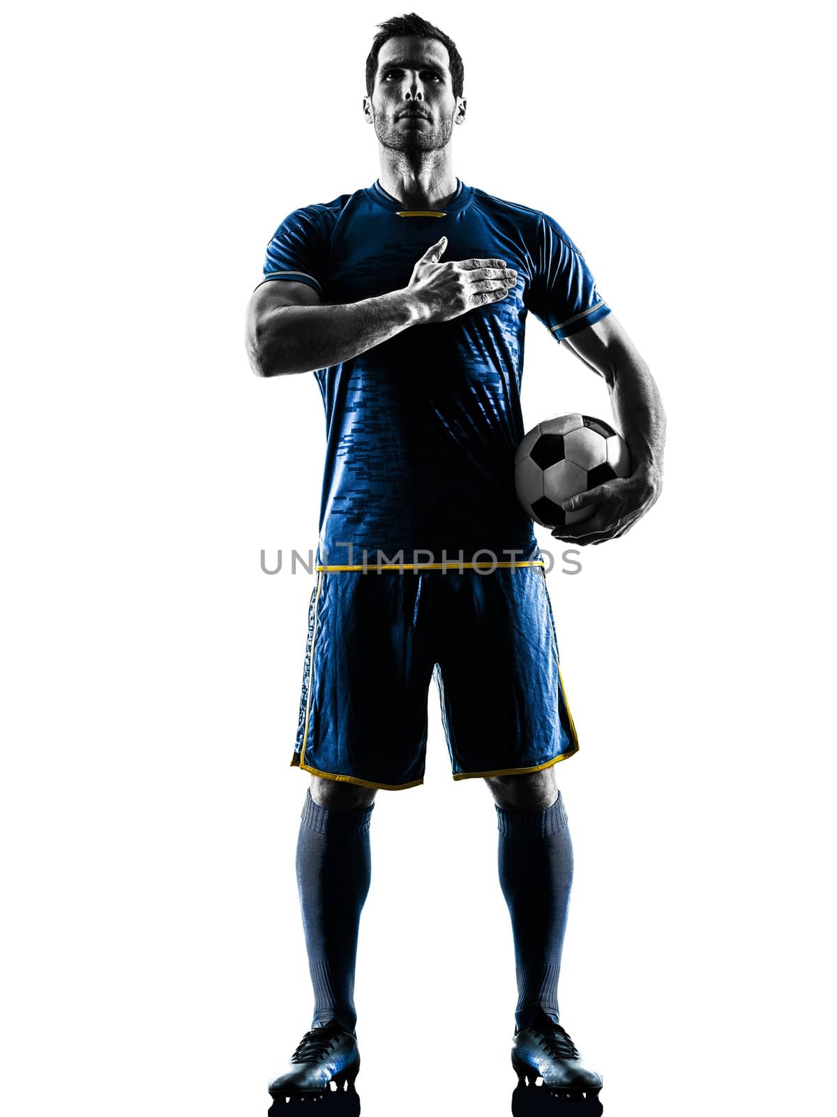 one caucasian soccer player man playing in silhouette isolated on white background