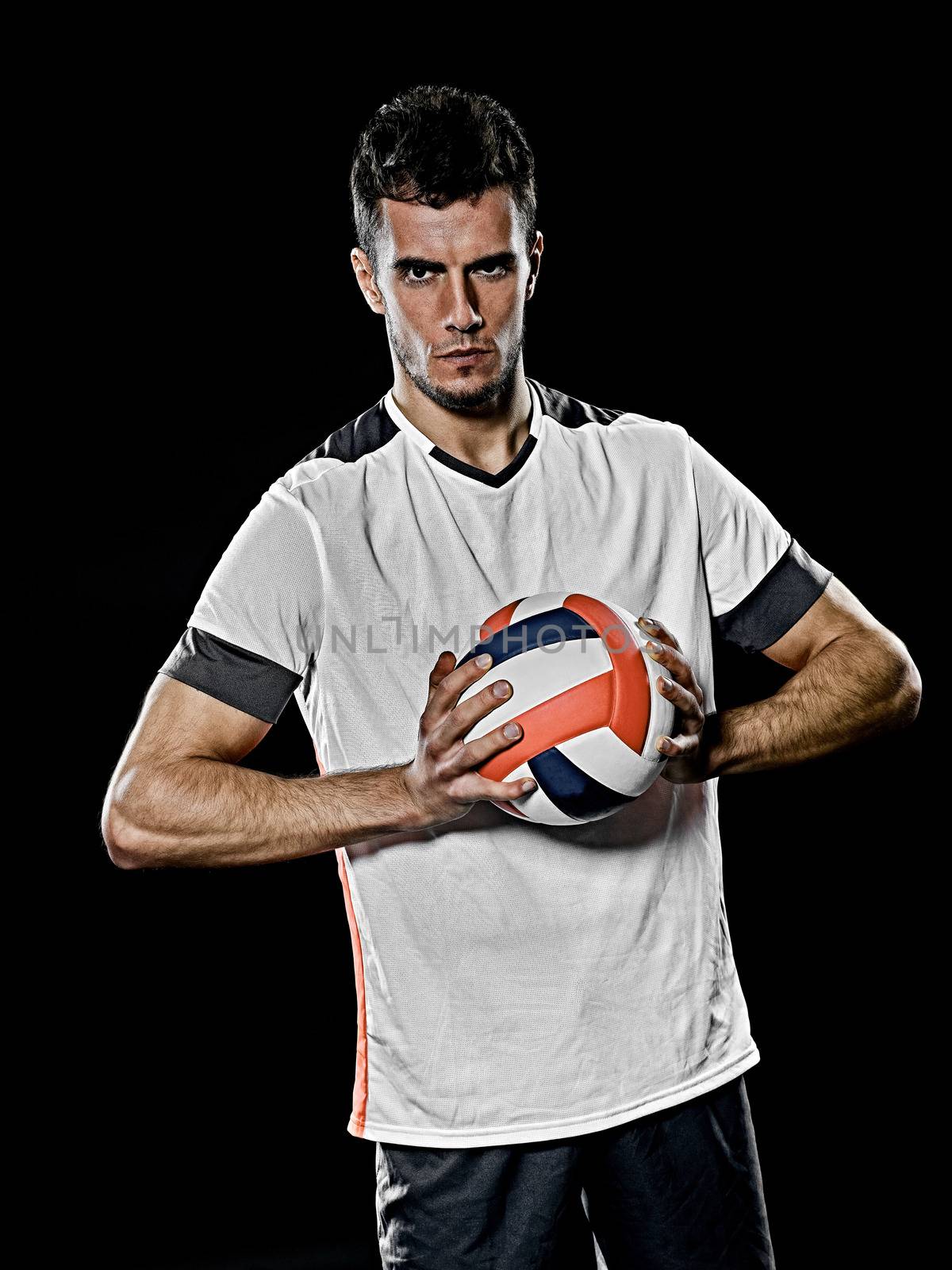 caucasian young volley ball player manisolated black background by PIXSTILL