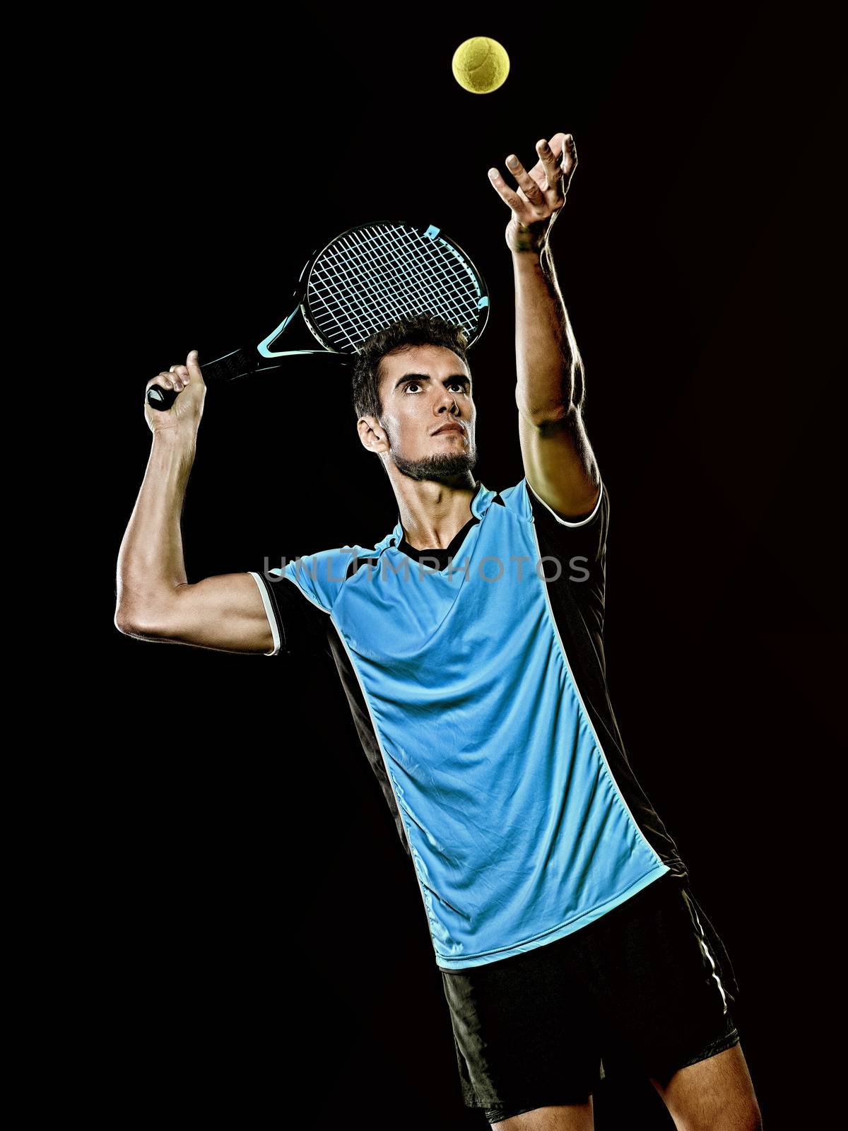 caucasian young tennis player man isolated black background by PIXSTILL