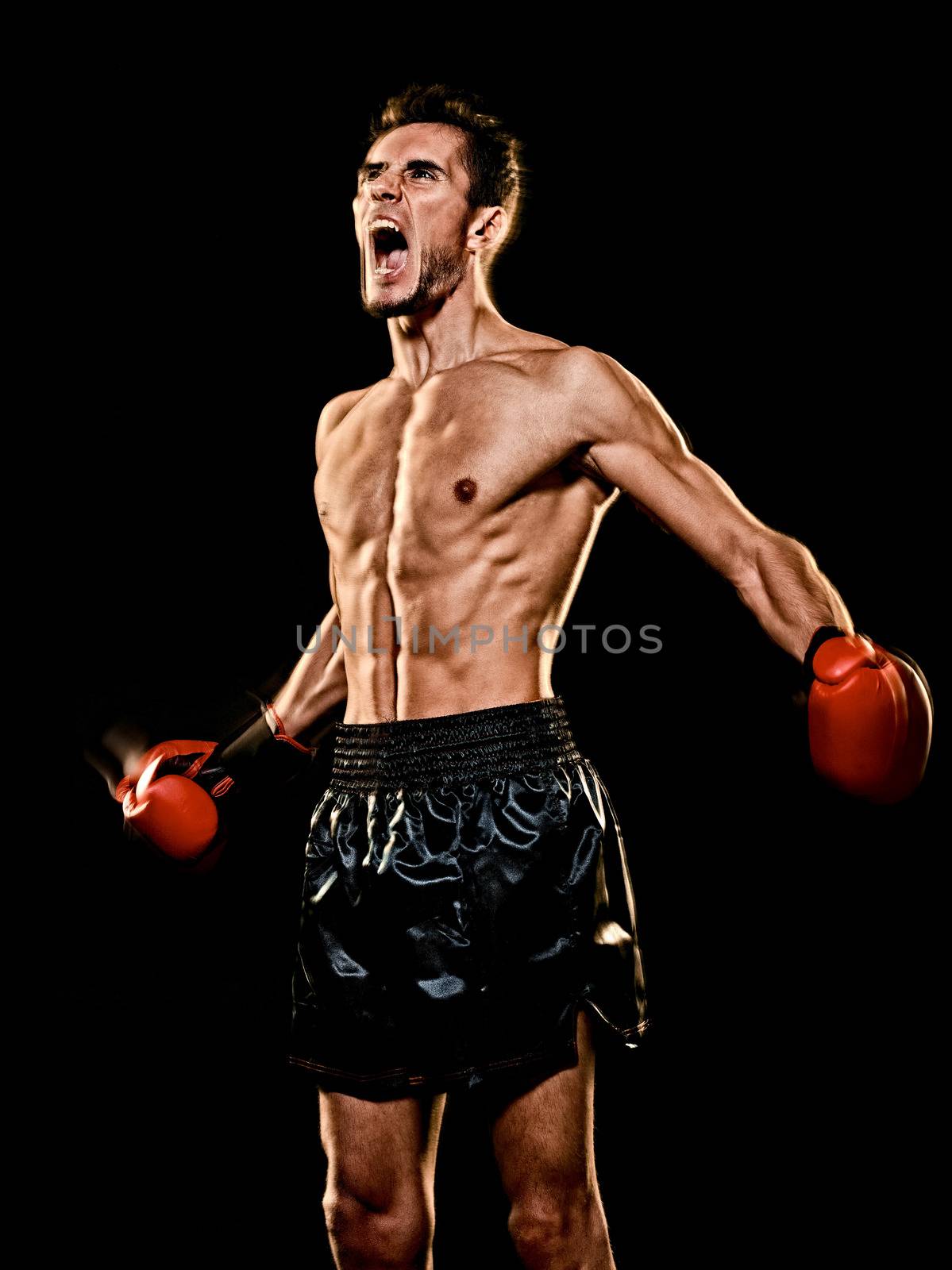 caucasian young boxer boxing man isolated black background by PIXSTILL