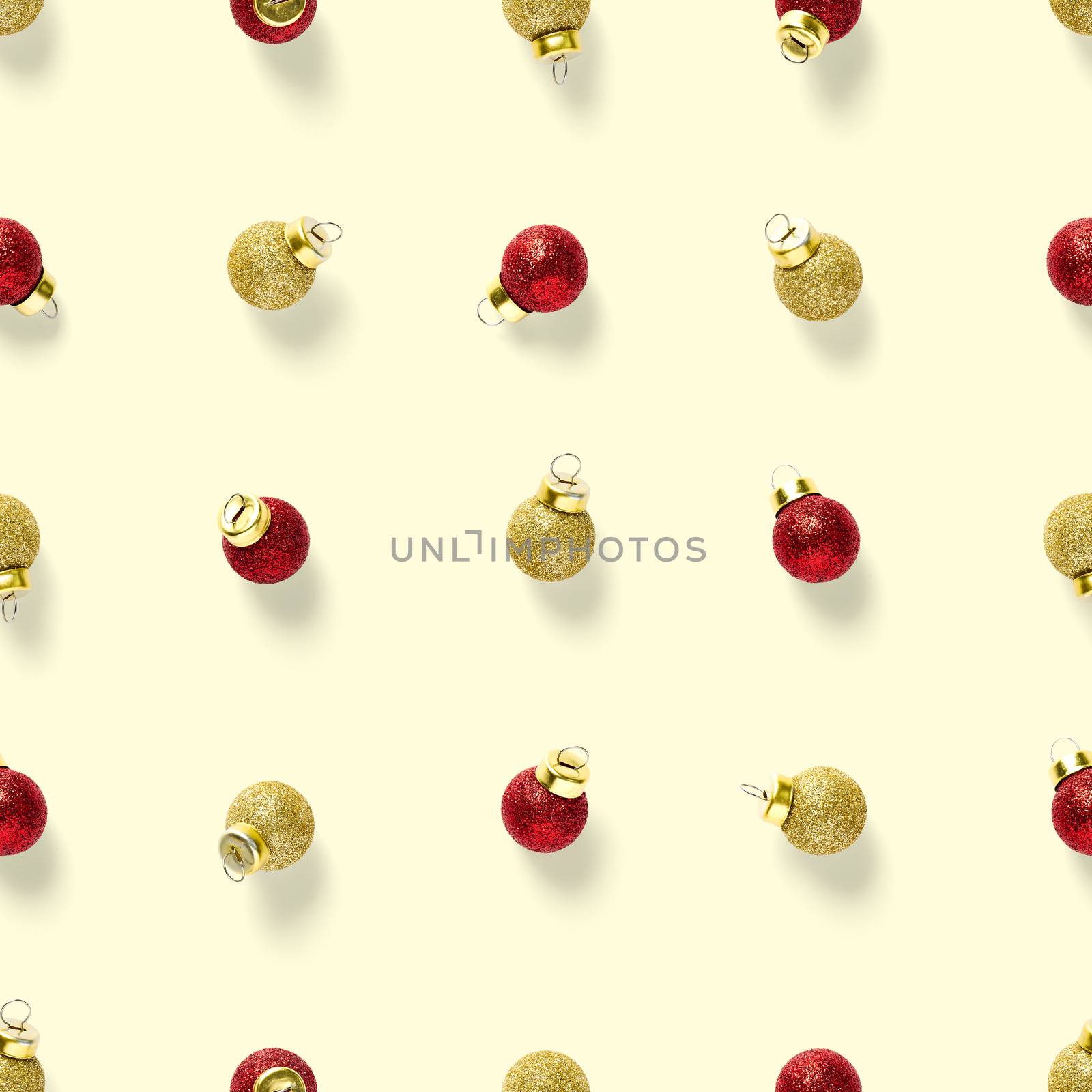 Seamless pattern with red andgold Christmas decorations on yellow background. Christmas red ornaments Seamless pattern. Christmas abstract background made from balls.