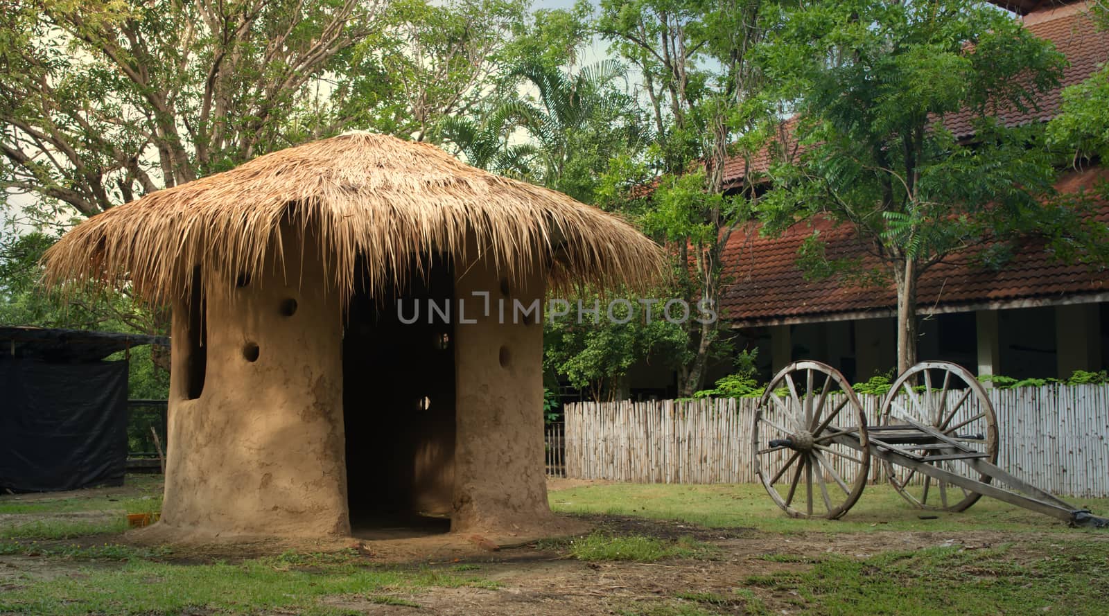 A small thatched-roof mud house common in Thailand.