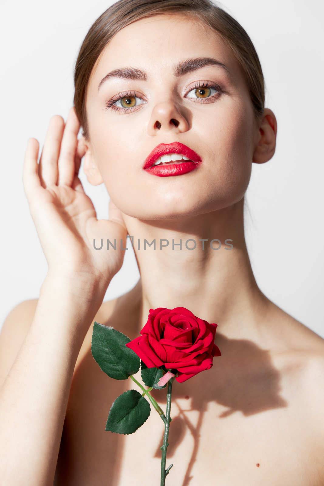 Sexy woman With a rose in his hands, charm front view