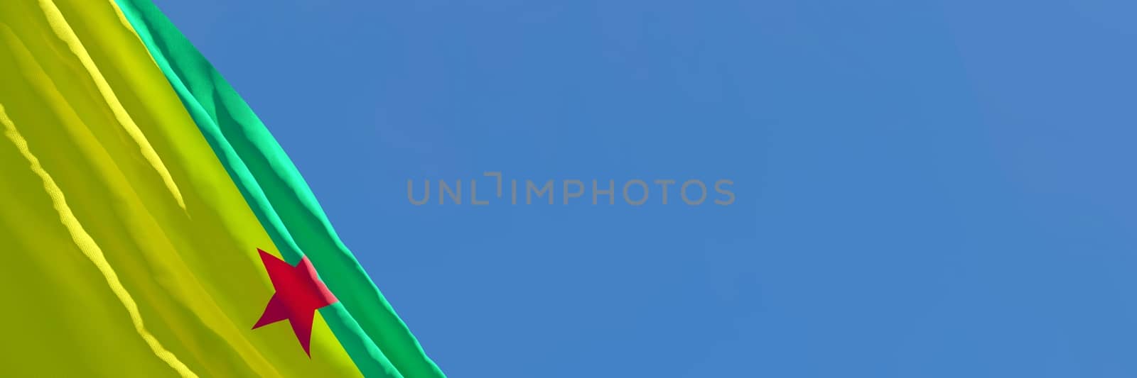 3D rendering of the national flag of French Guiana waving in the wind against a blue sky