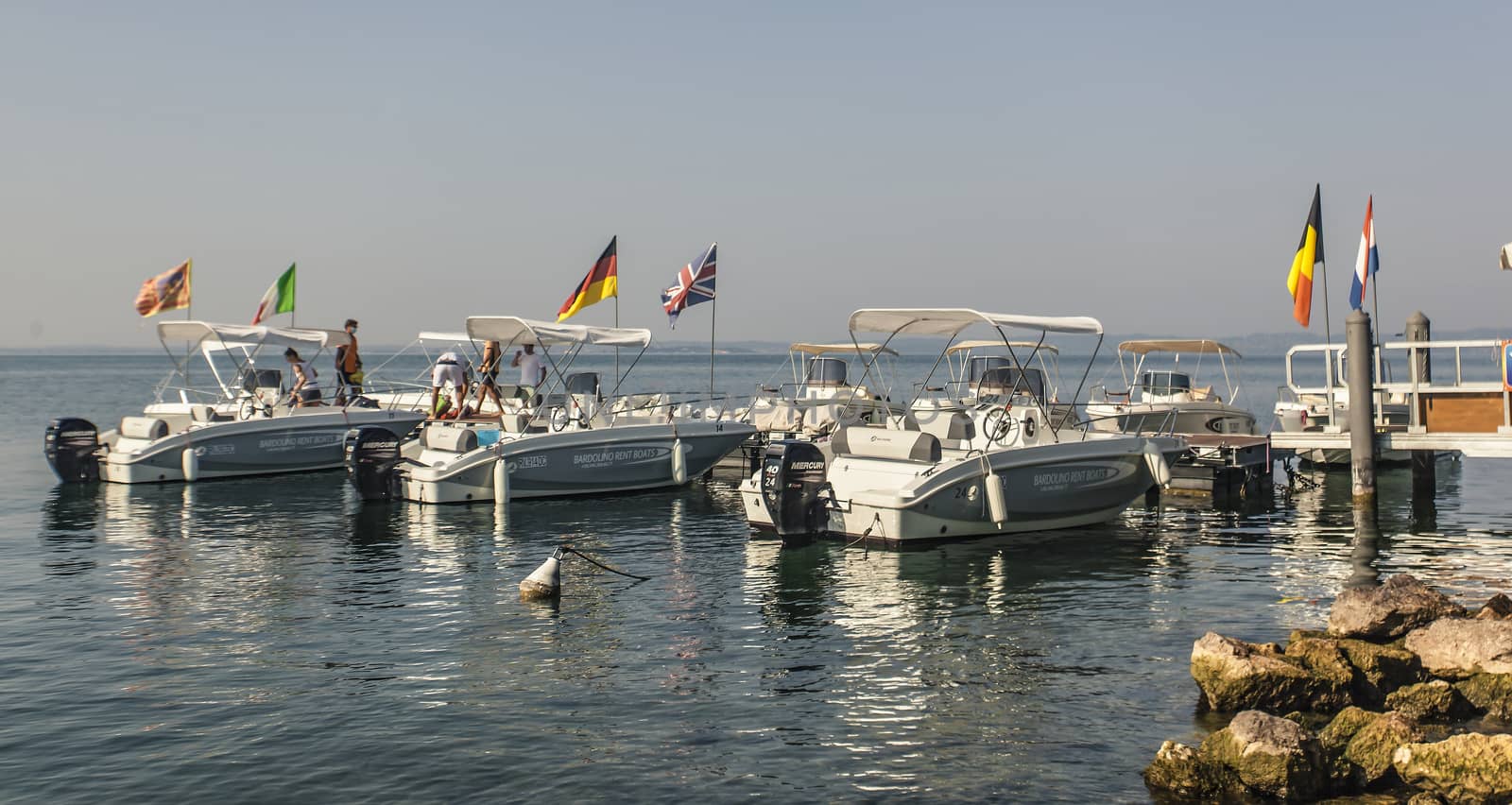 Port on Garda Lake of Bardolino with boats by pippocarlot