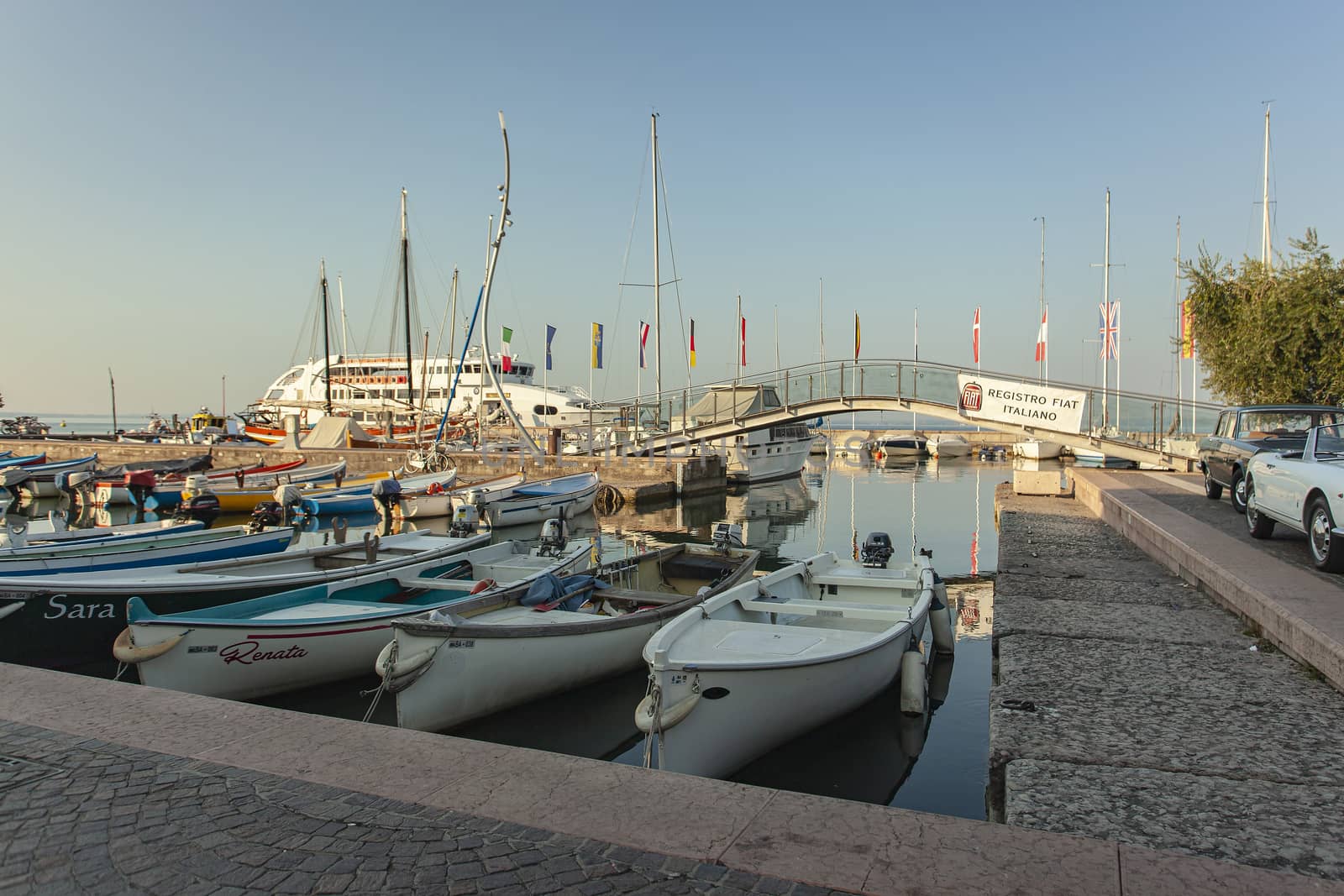 Port on Garda Lake of Bardolino with colored boats 7 by pippocarlot
