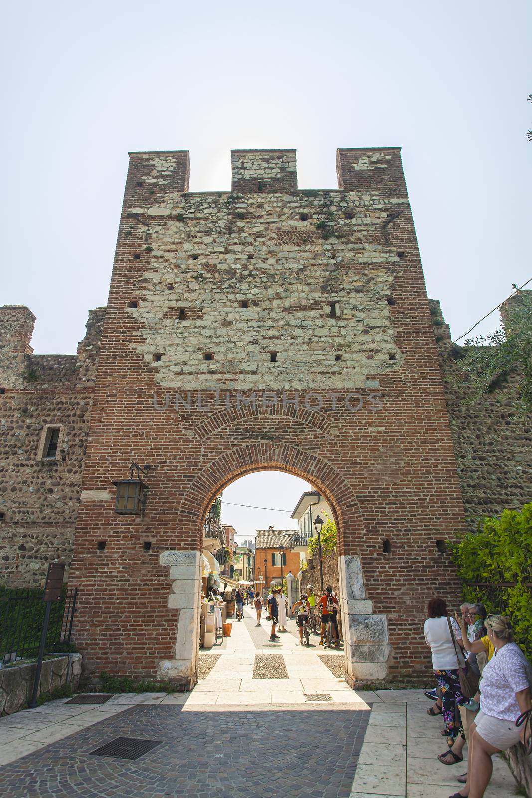 LAZISE, ITALY 16 SEPTEMBER 2020: Medieval Castle of Lazise in Italy under a blue sky