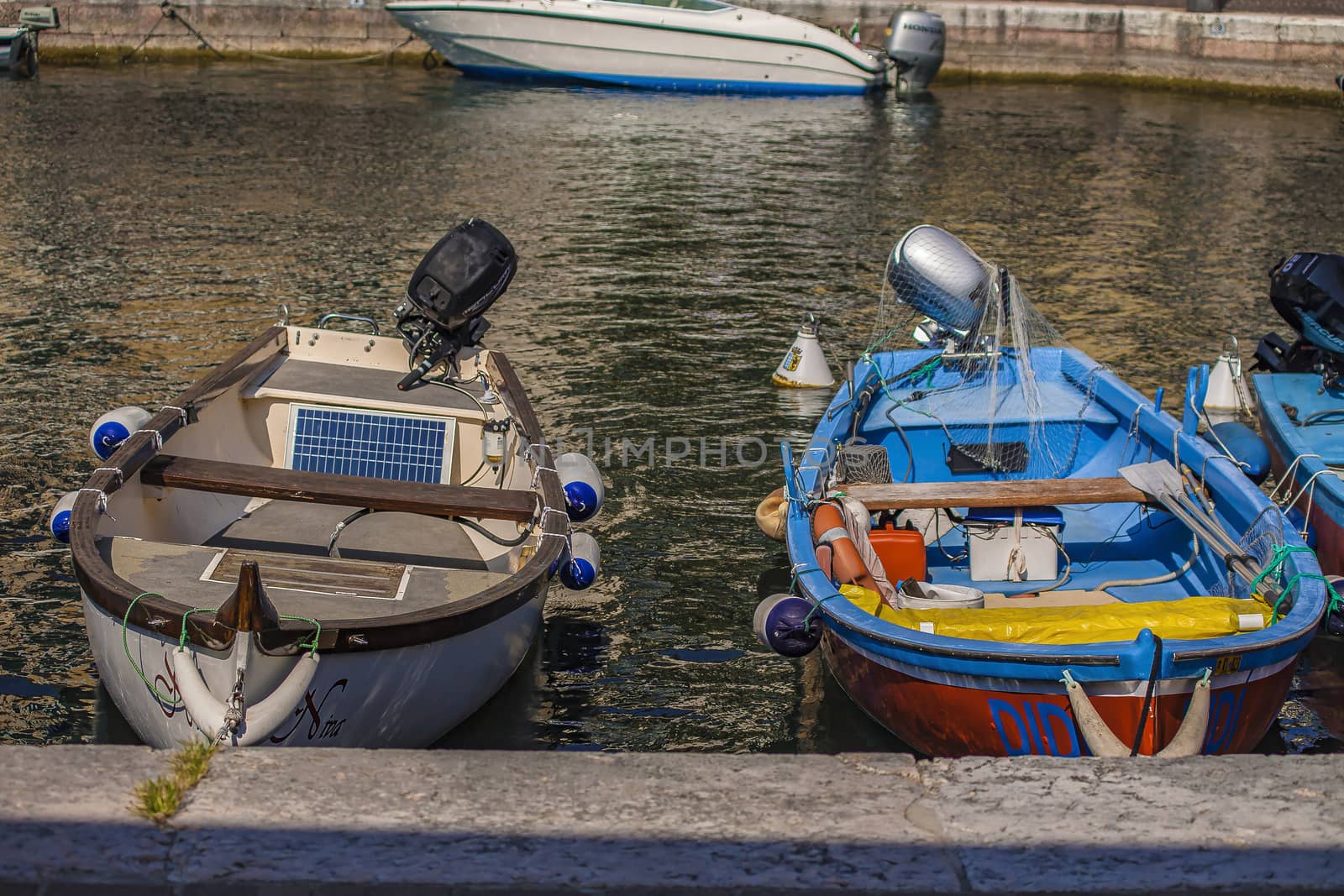 LAZISE, ITALY 16 SEPTEMBER 2020: Colored boat detail under sunlight