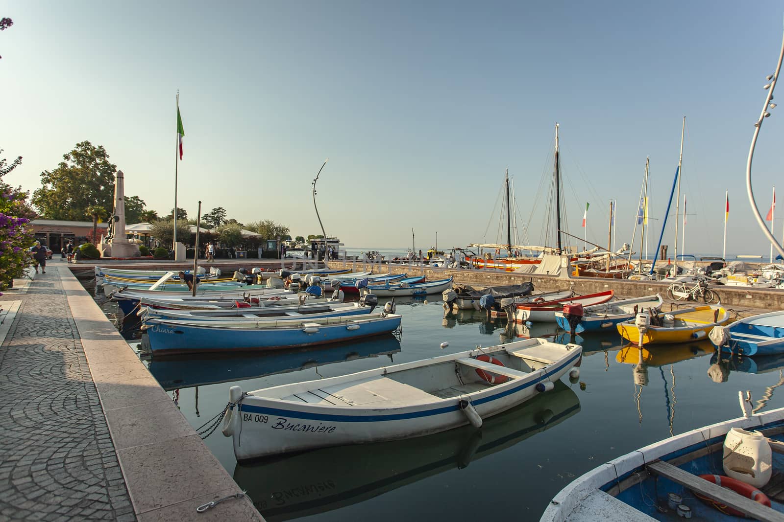 Port on Garda Lake of Bardolino with colored boats 9 by pippocarlot