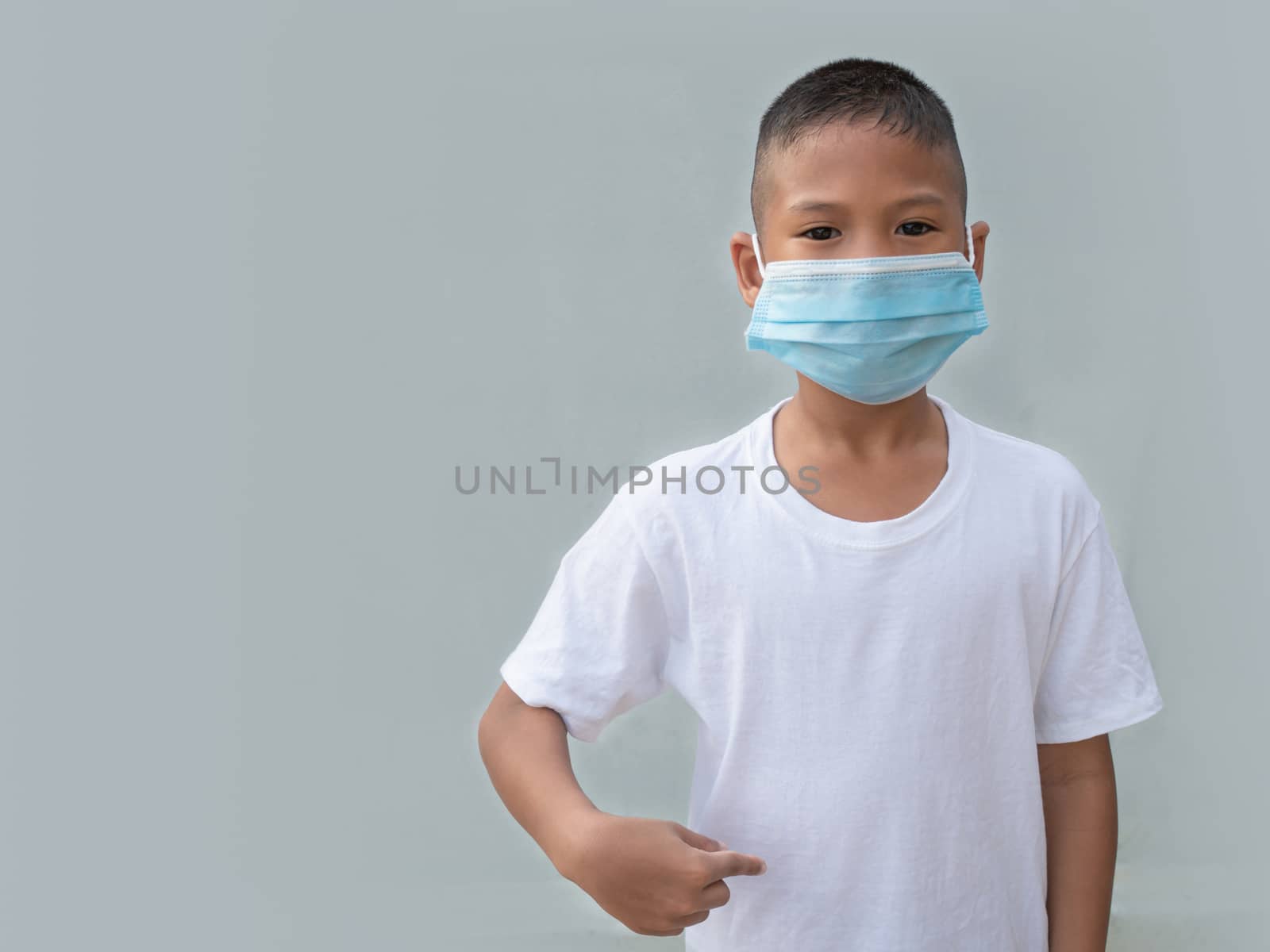 Boy wearing a protective mask On a white background. New normal concept.