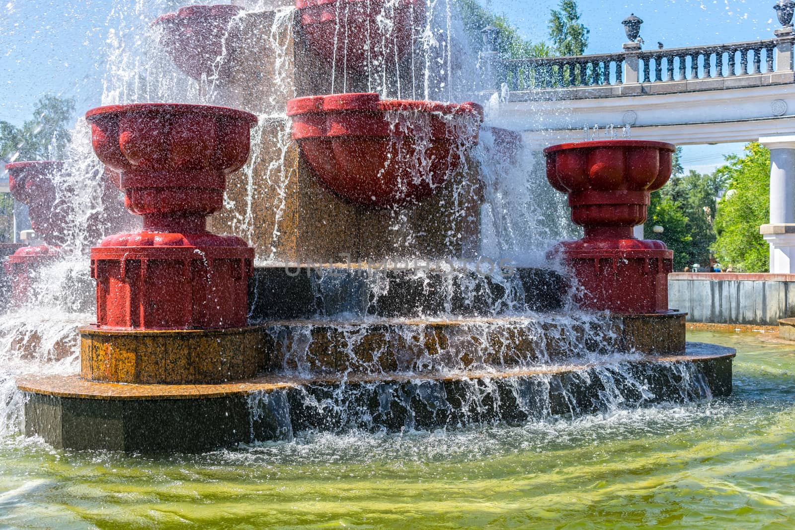 Water and splashes in the city fountain in summer