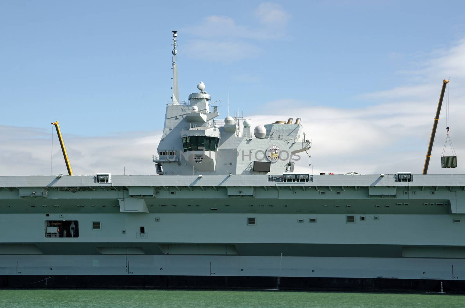 Superstructure and bridge of the Royal Navy aircraft carrier HMS Prince of Wales moored at Portsmouth Harbour, Hampshire.