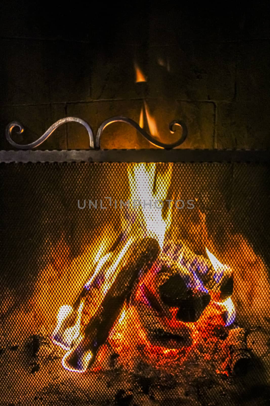 Romantic bright open fire on wood in hut in Norway. by Arkadij