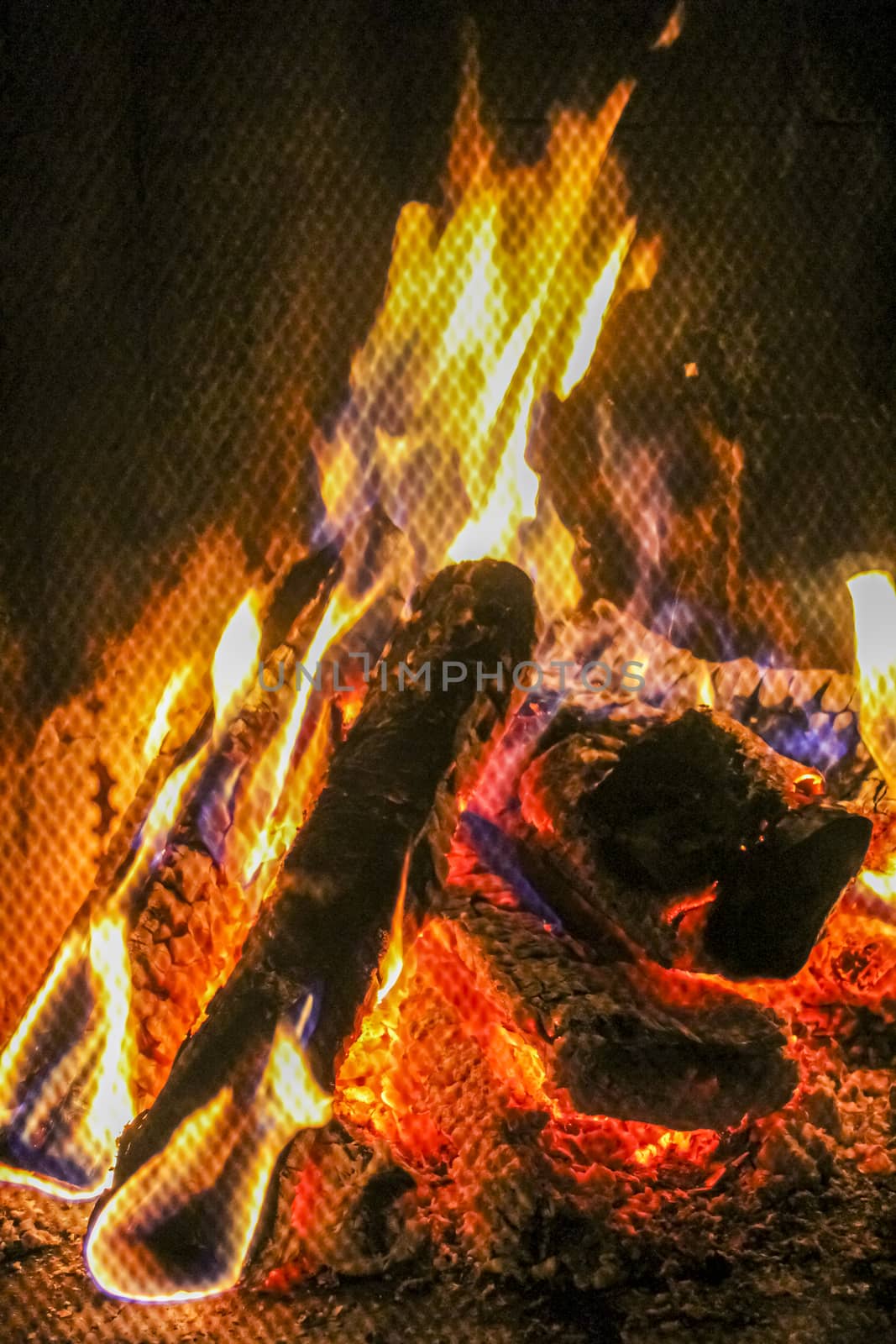 Romantic bright open fire on wood in a hut in Norway.