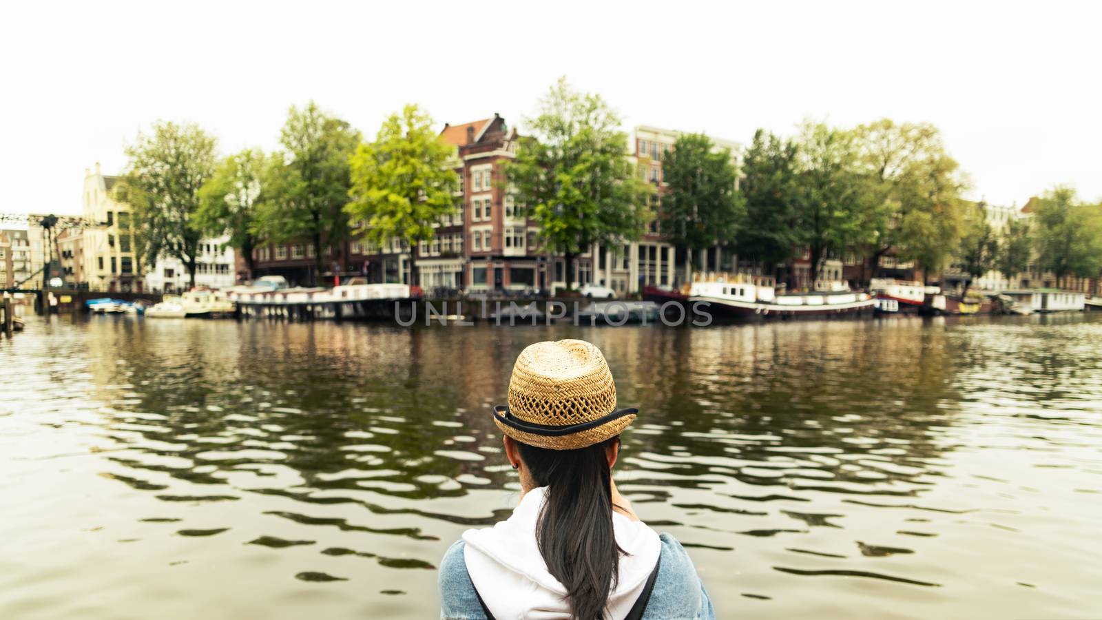 Outdoor lifestyle portrait of pretty young woman having fun in the city in Europe with digital camera travel photo of photographer Making pictures in hipster style