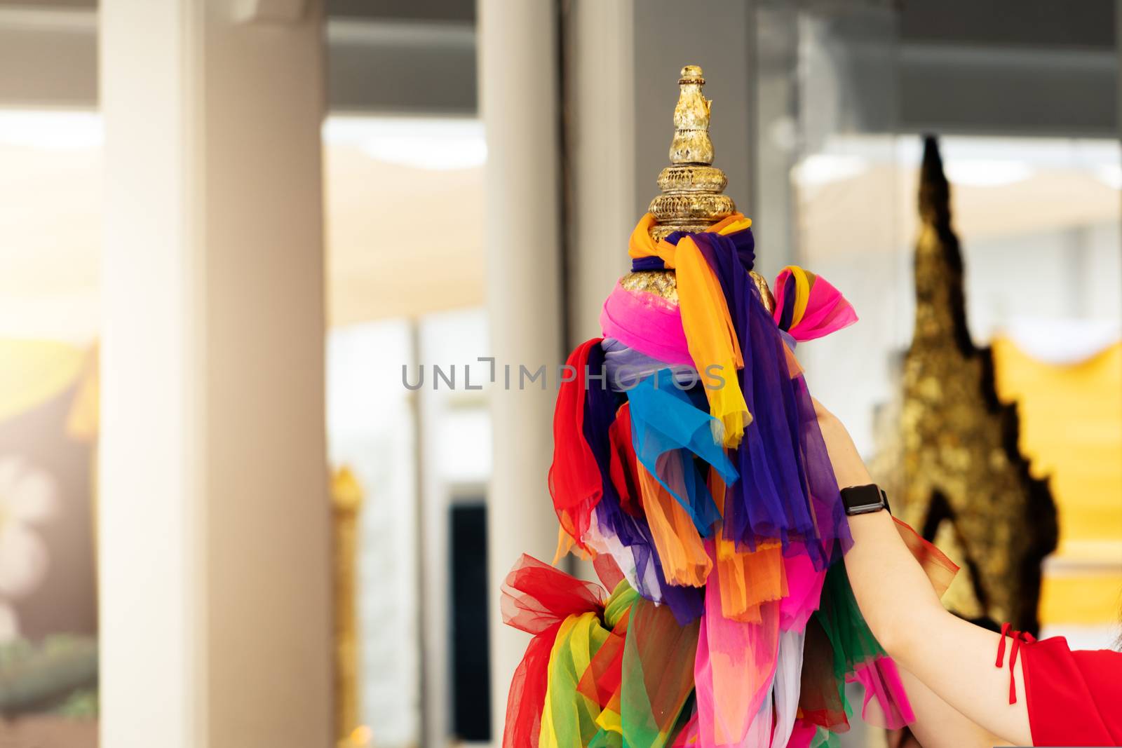 The traditional colorful fabrics tied in the Thai Buddhist Temple for praying, colorful fabric according to faith