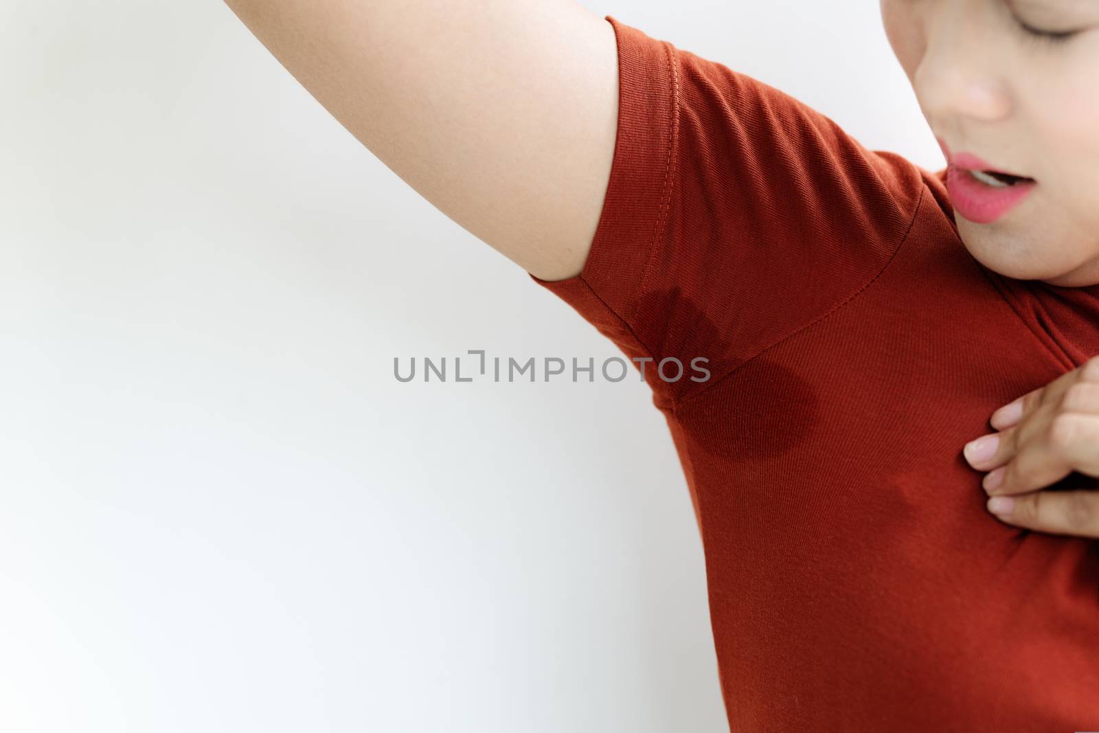 woman with hyperhidrosis sweating. Young Asia woman with sweat stain on her underarm clothes. Healthcare concept