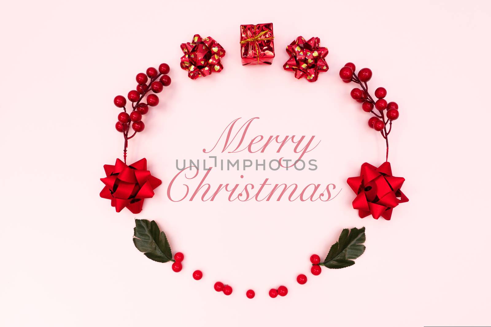 Christmas wreath on pink background. Christmas decoration. Flat lay, top view, copy space