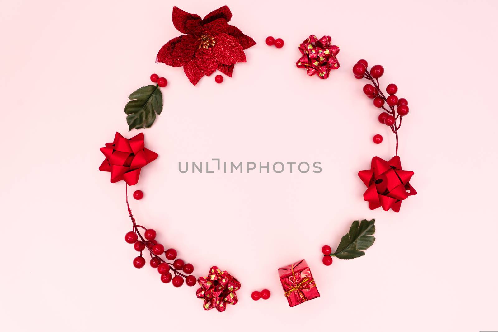 Christmas wreath on pink background. Christmas decoration. Flat lay, top view, copy space
