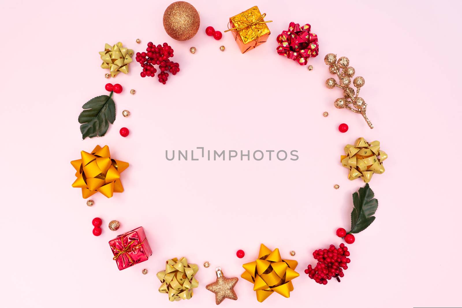 Christmas wreath on pink background. Christmas decoration. Flat lay, top view, copy space