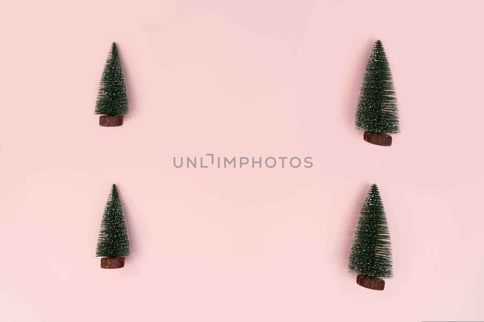 Christmas tree on pink background. Christmas, winter, new year concept. Flat lay, top view