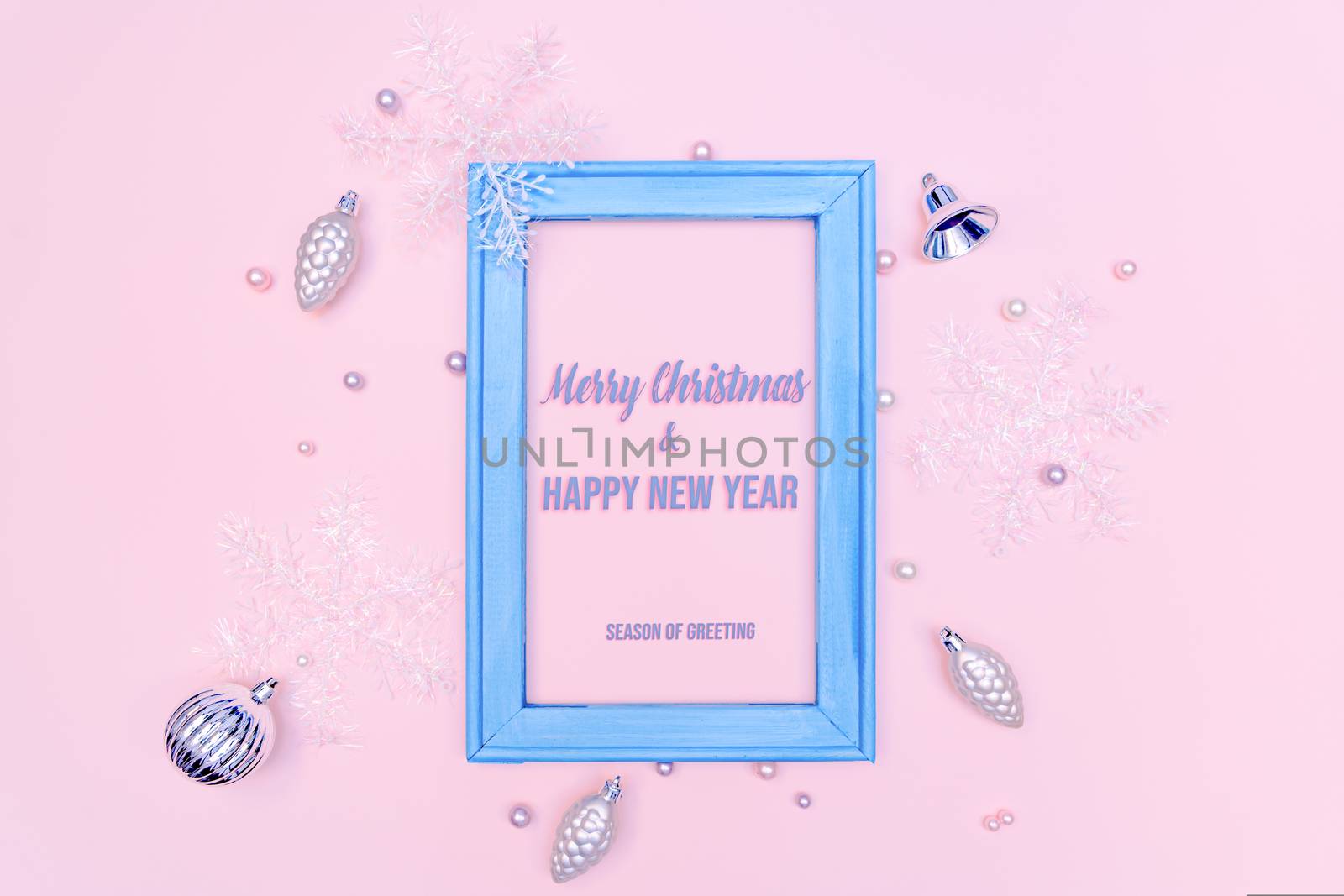 Christmas gold ball and snowflake with photo frame on pink background