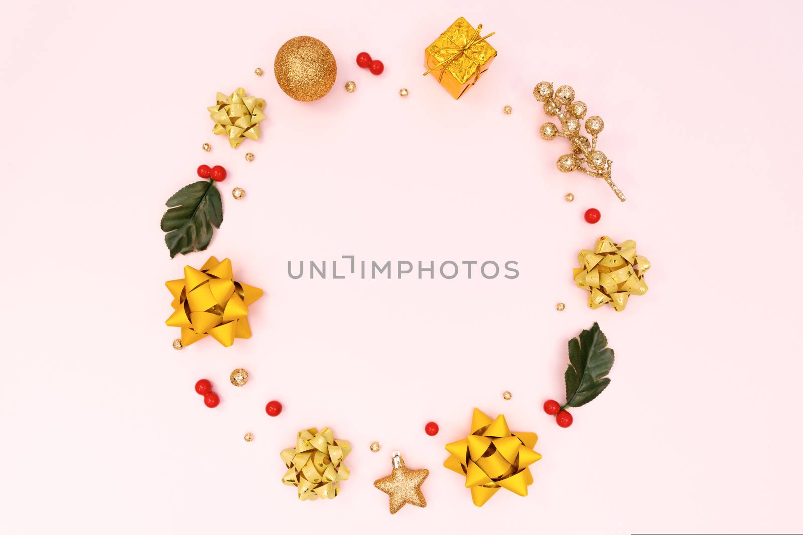 Christmas wreath on pink background. Christmas decoration. Flat lay, top view, copy space