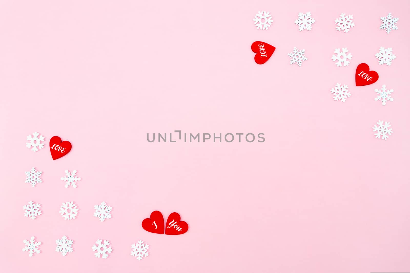 Valentine's Day background. red hearts and snowflakes on pink background. Valentines day concept. Flat lay, top view, copy space