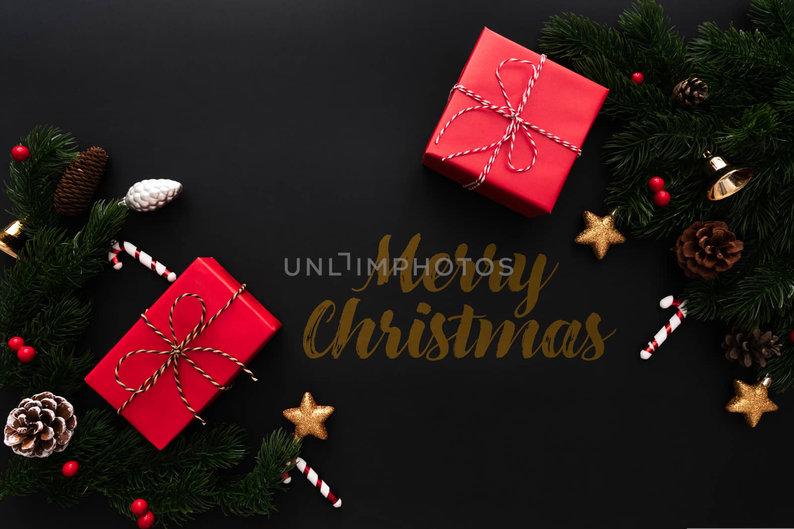 Christmas gift box and pine tree with xmas decoration on black background