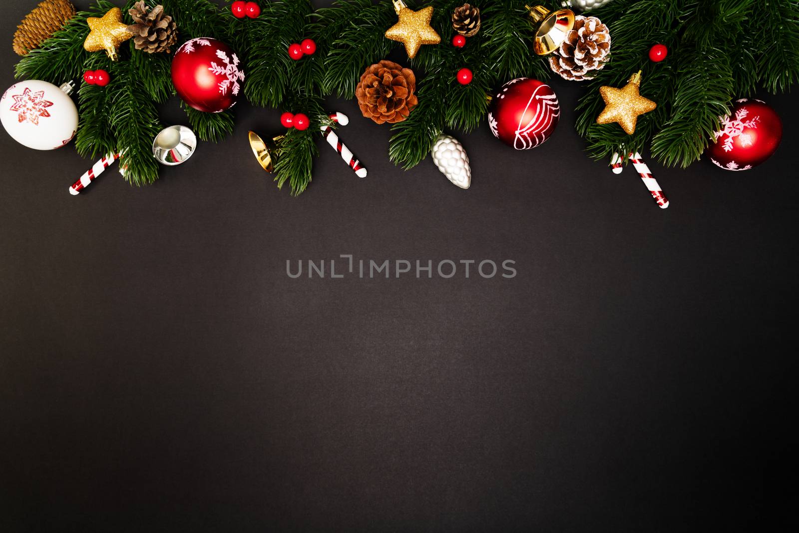Christmas pine tree with xmas decoration on black background