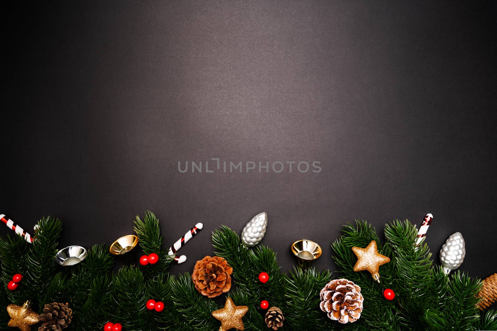 Christmas pine tree with xmas decoration on black background