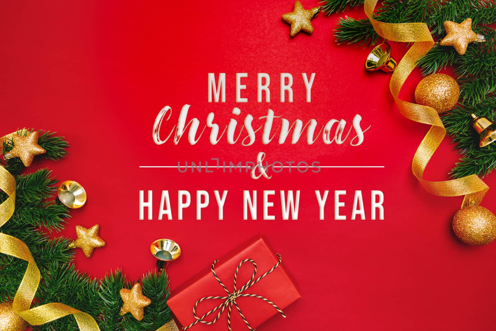 Christmas present and pine tree with xmas decoration on Red background