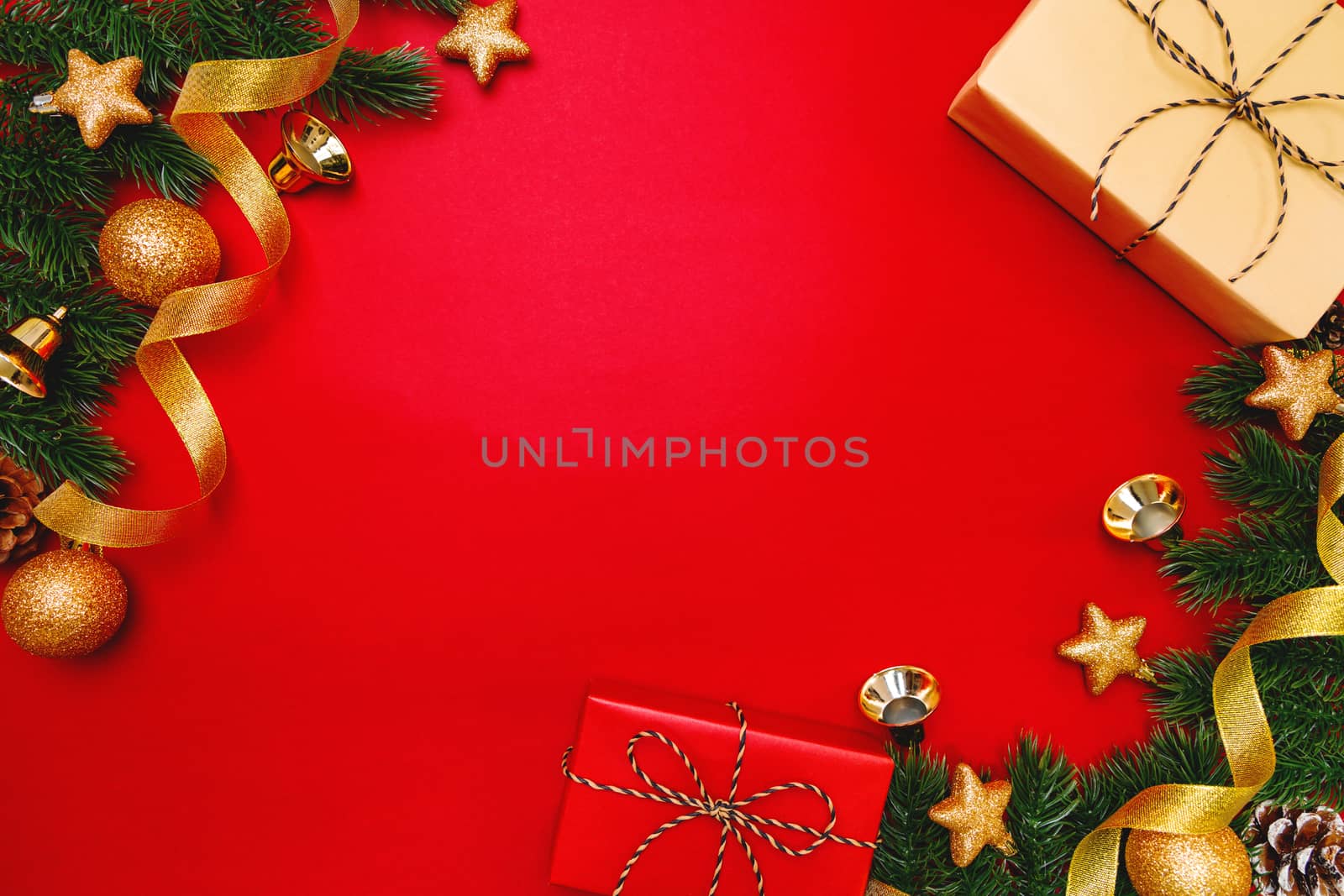 Christmas present and pine tree with xmas decoration on Red background