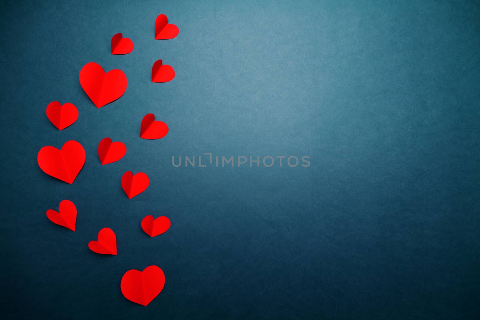 Valentine card with red heart on blue background, abstract, flat lay, top view