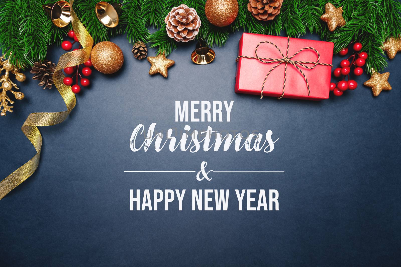 Christmas present and pine tree with xmas decoration on blue background
