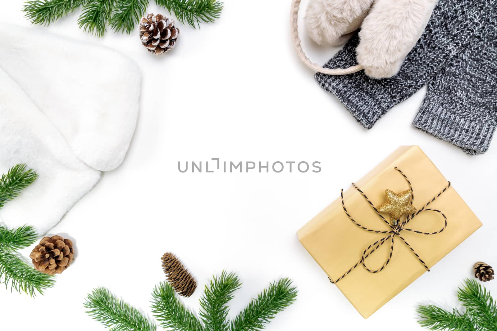 Christmas winter composition. Christmas gifts box with pine cones, fir branches on white background. Flat lay, top view, copy space